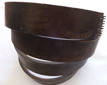 A brown leather belt made by Carters saddlery Warrnambool.