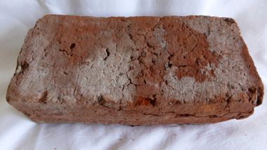 Red clay rectangular brick manufactured circa 1850.  retrieved from demolition of 94 Merri Street, Warrnambool, 