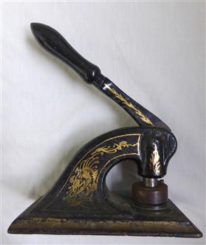 Tool for imprinting Newcombe timber company seal