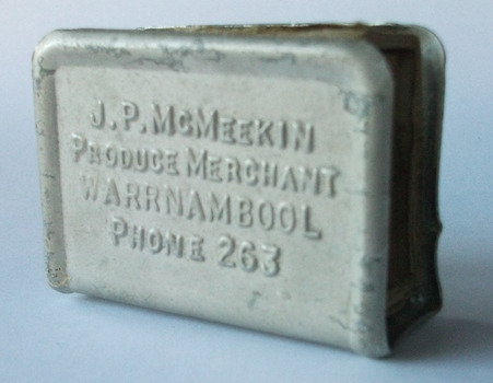 This is a match box holder advertising J P McMeekin
