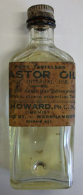 Dispensing Bottle with label T D Howard, chemist