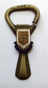 Souvenir bottle opener with City of Warrnambool logo.