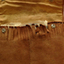 This is a tan suede pouch with fringing and which has a packaged  cello strings inside.