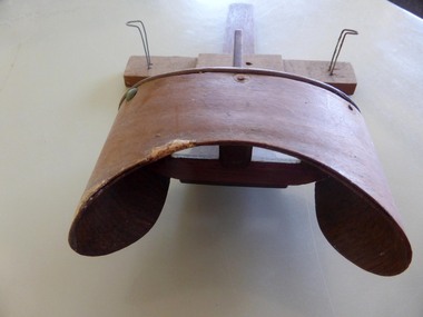 THis is a wooden stereoscope,used to view photographs.