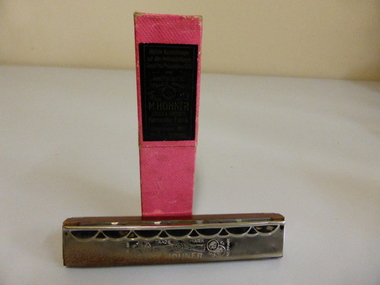 This is a mouth organ and box.