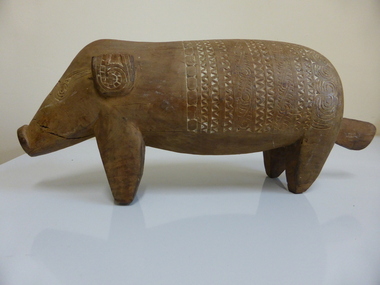 This is a wooden carved pig