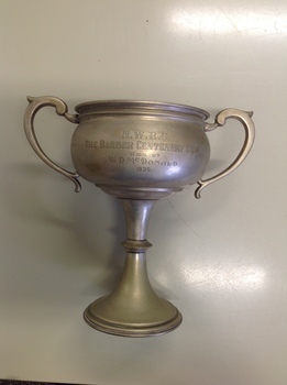 This is a silverplated trophy for rifle shooting.