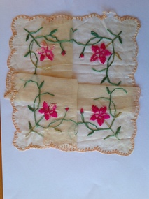 This is a square cream silk hankerchief which is embroidered with pink flowers and green foliage.