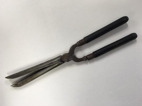 These are pronged metal hair curling tongs.