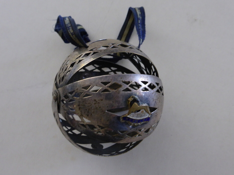 This is a silver wool holder from the Wembley exhibion of 1924.