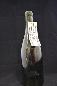 Bottle, Sheldricks Beer Bottle - Green with tag, Early 20th century