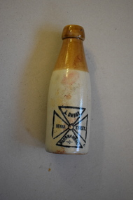 This is a cream and tan stoneware drink bottle  stamped A Darby Henna St Warrnambool.