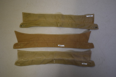 Three detachable army issue collars.