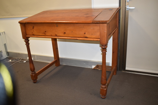 This is an old wooden teacher's desk from the Woodford school.