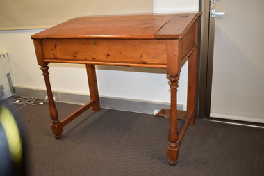 This is an old wooden teacher's desk from the Woodford school.