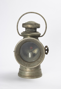 This is a brass lamp from early 20th century.