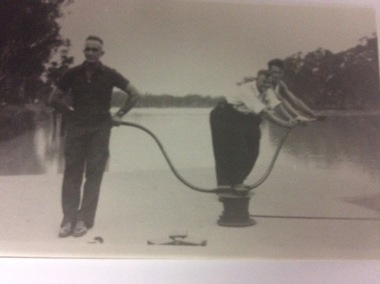 A black and white photograph of three men working on a lock, 20/09/1984