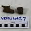 2 pieces of shrapnel purportedly striking the owner, Ian Stephen Macleod, on the helmet during the London Blitz in 1940