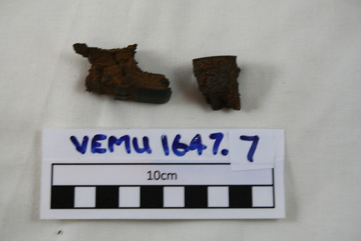 2 pieces of shrapnel purportedly striking the owner, Ian Stephen Macleod, on the helmet during the London Blitz in 1940