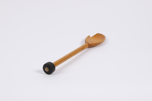 Wooden spoon - the striker for the dinner gong. Small piece broken off from the spoon section.