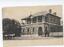Parkes Post and Telegraph Office with a horse-drawn carriage and six men outside.