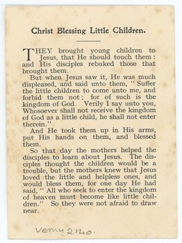 A yellowed postcard with paragraphs of black text printed on it.