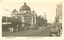 A yellowed black and white postcard depicting Flinders Street Station.