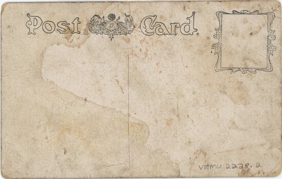 A postcard with printed text and a lion and unicorn at the top, and a decorated square for a stamp in the top right.