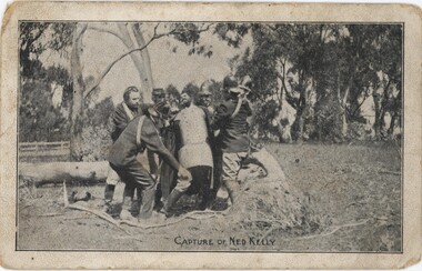 Postcard depicting six policemen detaining a man in a metal suit (Kelly).