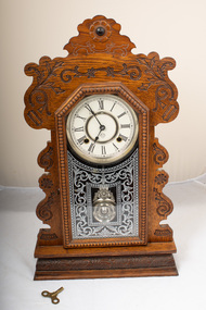Front of mantle clock with key