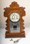 front of mantle clock with key and pendulum
