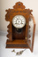 mantle clock with door open and key and pendulum 