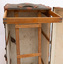 Upright and opened steamer trunk showing detail of wooden frame and clothes hanger.