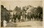 A group of children standing on a street in a Welsh village.