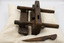 Plough plane and removed wooden blade clamp viewed from above, showing the blade slot
