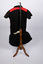 Back of netball uniform showing red and black top and black skirt
