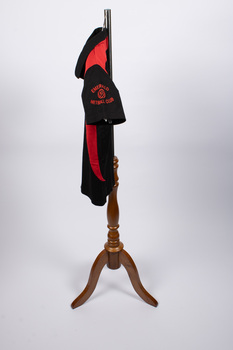Side view of netball uniform top with logo on sleeve visible