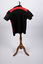 Back view of netball uniform top - black and red colors