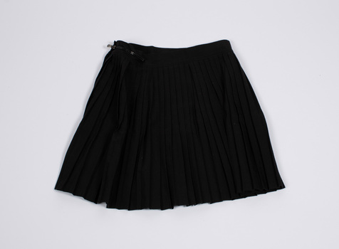Front view of black netball skirt laid flat