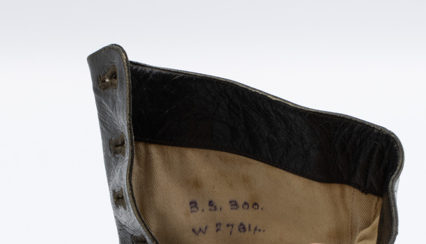 Image shows a handwritten inscription on the cream-coloured lining of the right shoe from a pair of black button-up boots. The top line appears to read: '3.5.300'. The bottom line appears to read: 'W271/"'