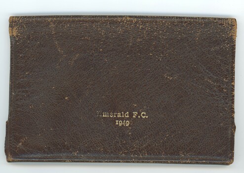 Front of closed wallet with inscriptions