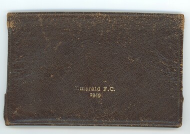 Front of closed wallet with inscriptions