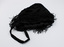 Black drawstring bag with handle in the foreground