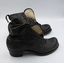 A pair of black low-heeled boots with their right sides facing the camera.