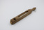 A thermometer visible through a long, rounded gap in its rectangular wooden casing.