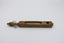 A thermometer visible through its wooden case, with a wooden handle on the end of the case.