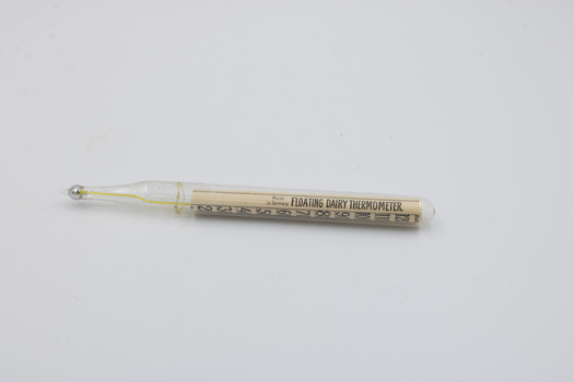 A dairy thermometer, with the label 'Floating Dairy Thermometer' facing the camera.