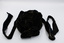 Front of black velvet hat with black velvet bow and two black ribbons for tying under the chin.