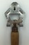 Head of the bottle and can opener showing maker's name and model number.