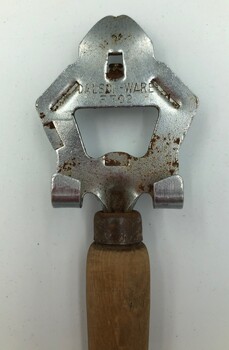 Head of the bottle and can opener showing maker's name and model number.